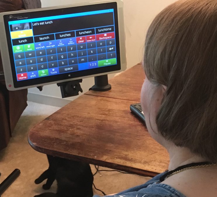 Woman uses eye gaze technology with voice synthesizers.